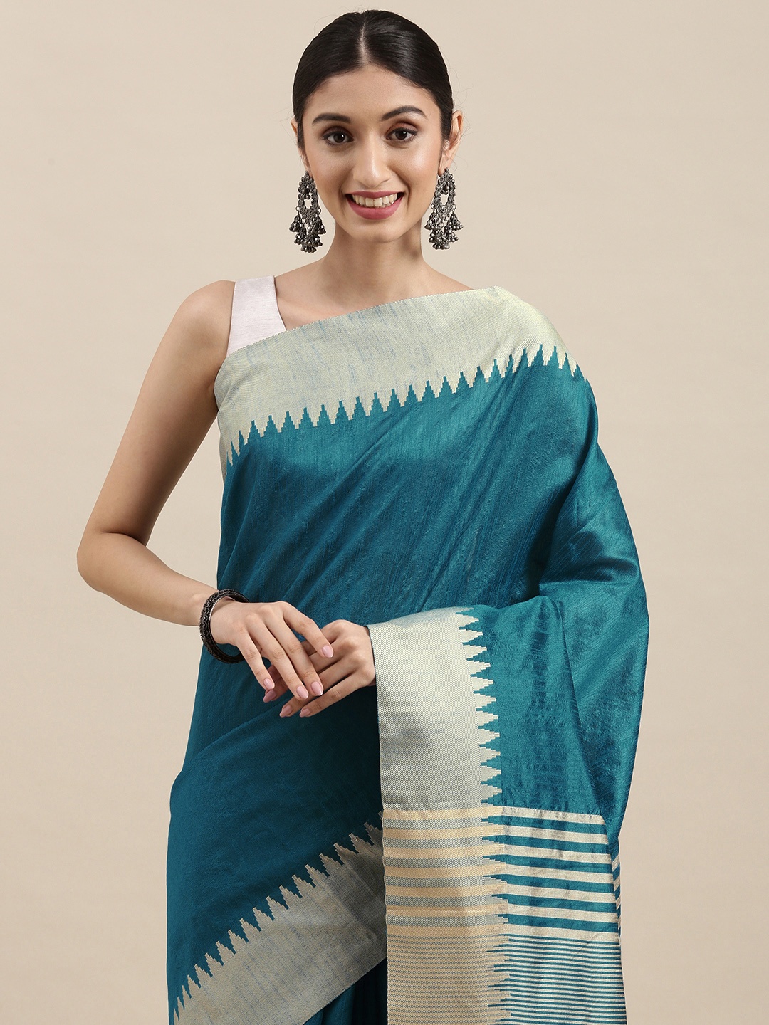 

Mitera Blue & Silver Solid Woven Border Saree