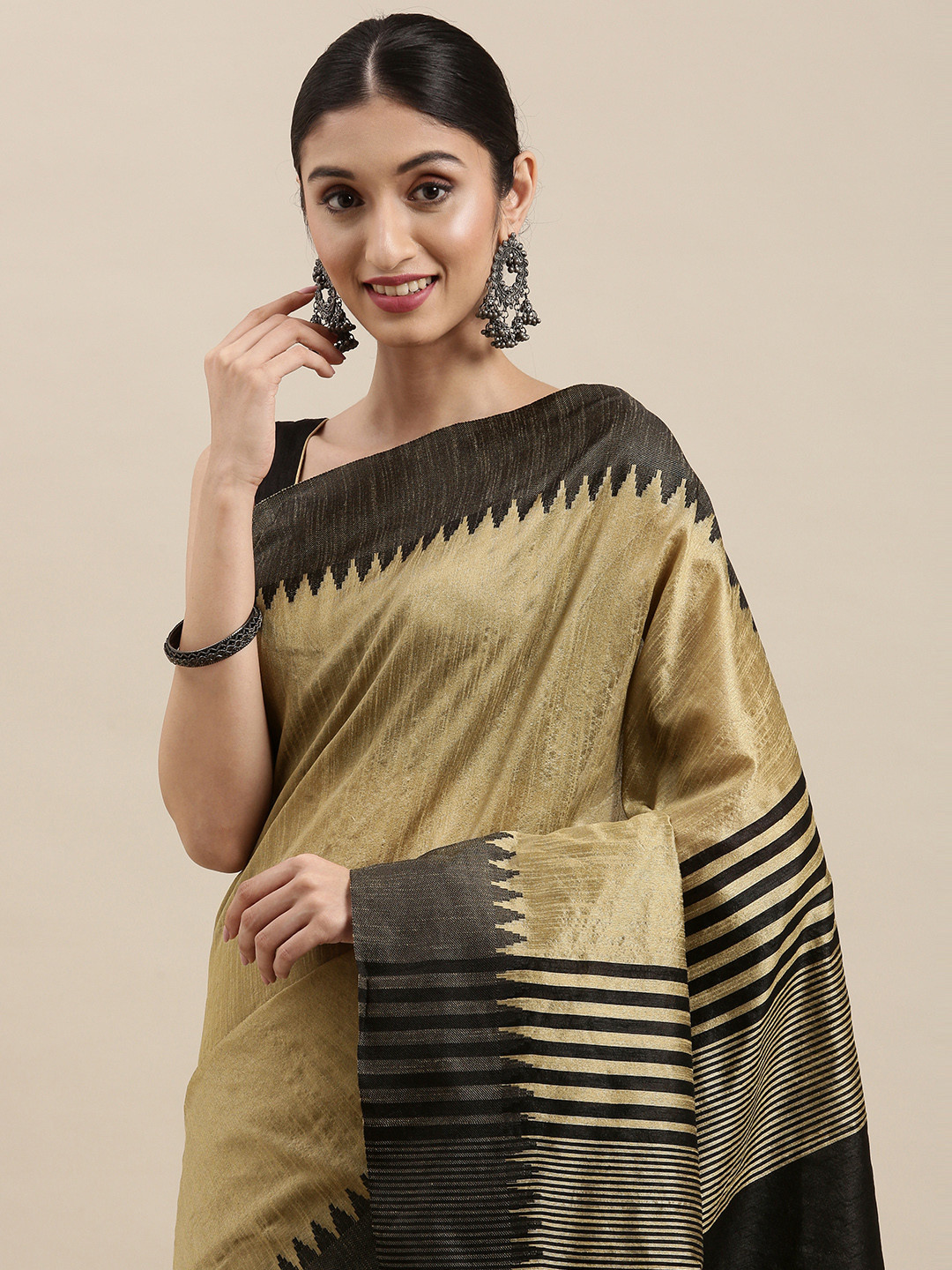 

Mitera Beige & Black Solid Woven Border Saree