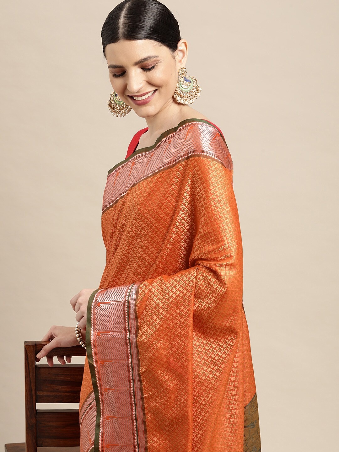 

Leeza Store Orange Ethnic Motifs Woven Design Zari Silk Blend Banarasi Saree