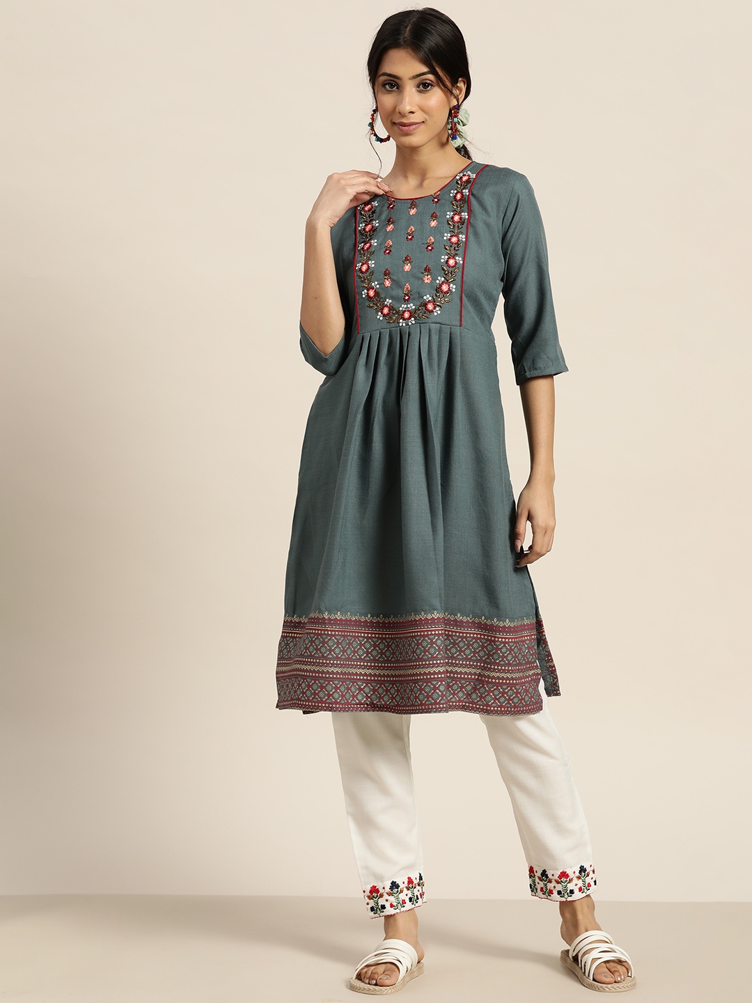 

Sangria Women Teal Blue Ethnic Motifs Embroidered Kurta with Trousers