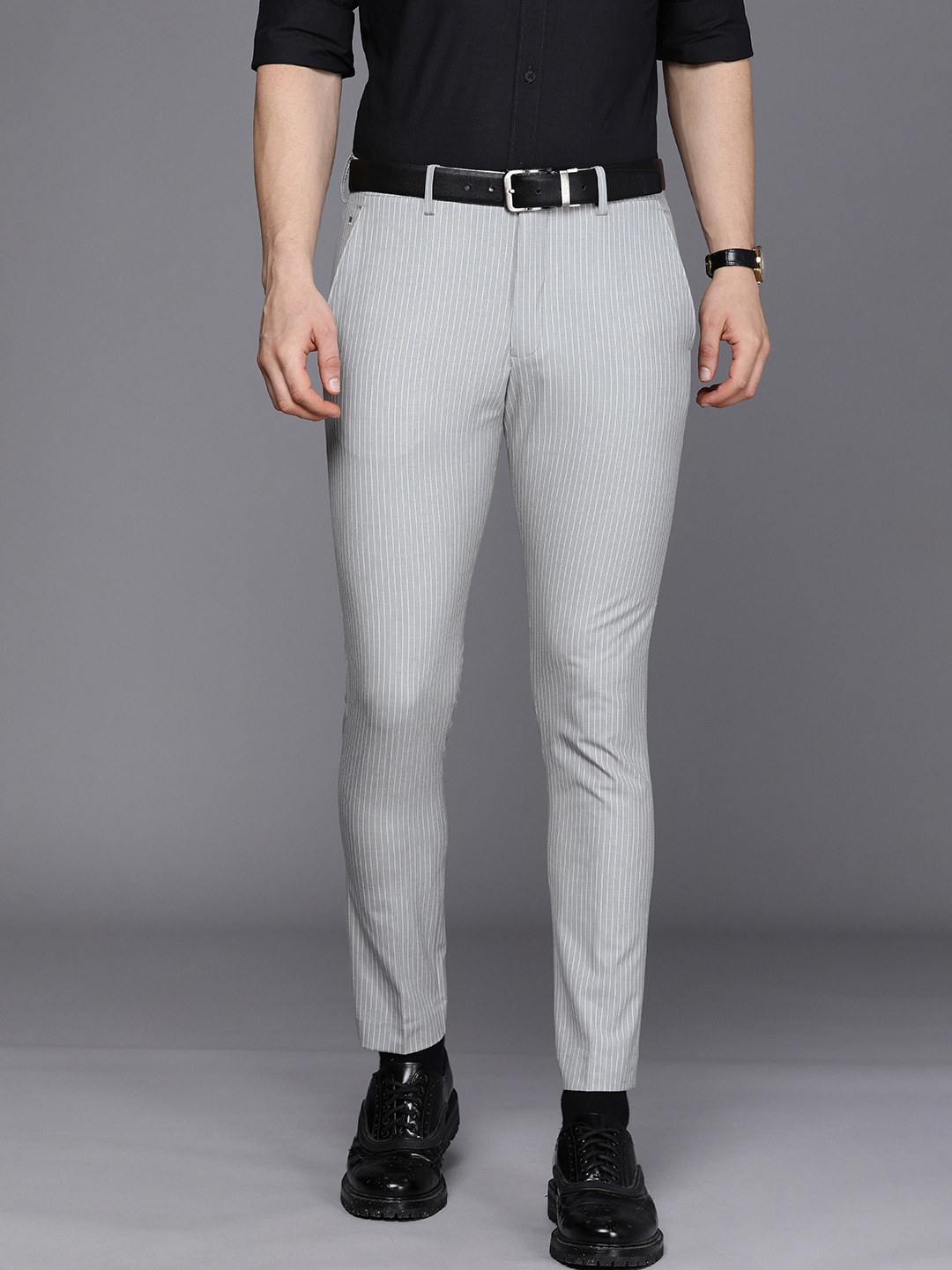 

Louis Philippe Men Grey & White Striped Carrot Fit Trousers