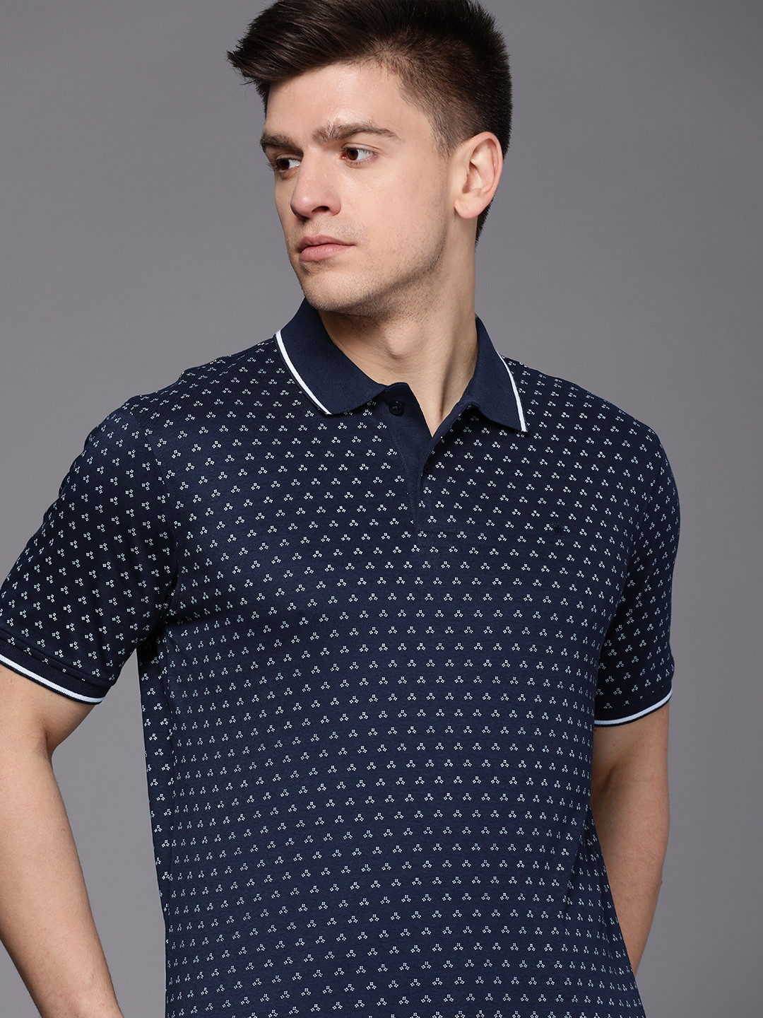 

Louis Philippe Men Navy Blue & White Geometric Printed Polo Collar Pure Cotton T-shirt