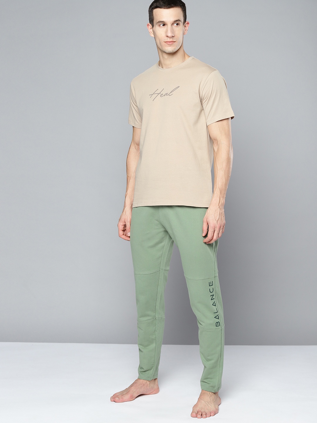 

HRX By Hrithik Roshan Yoga Men Jade Organic Cotton Typography Track Pants, Green