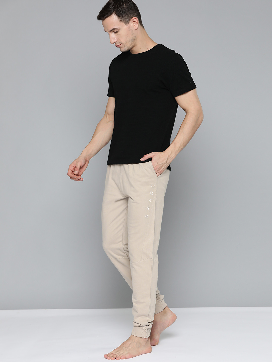 

HRX By Hrithik Roshan Yoga Men Myrobolan Organic Cotton Solid Track Pants, Beige