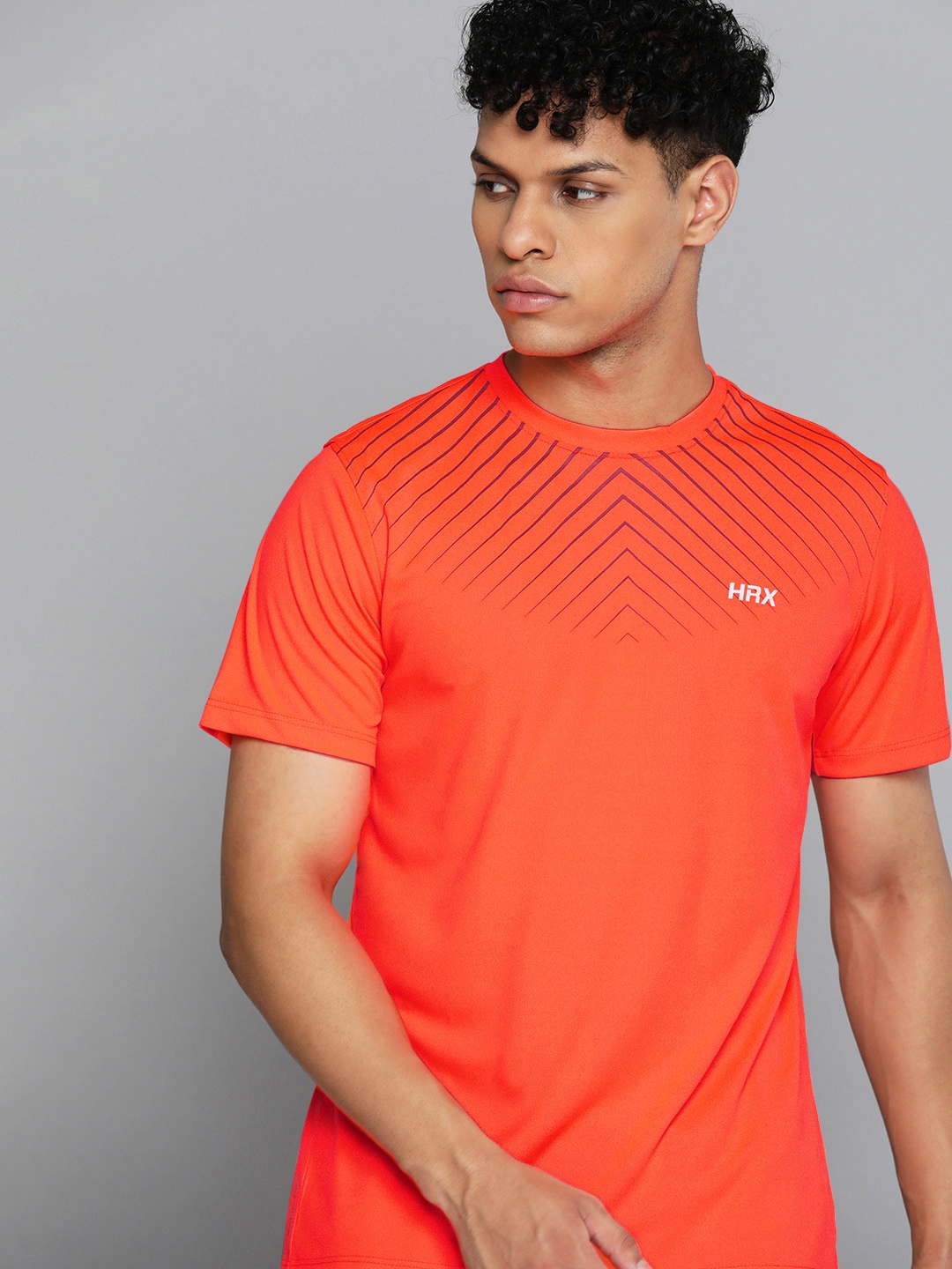 

HRX By Hrithik Roshan Training Men Neon Orange Rapid-Dry Geometric Tshirts