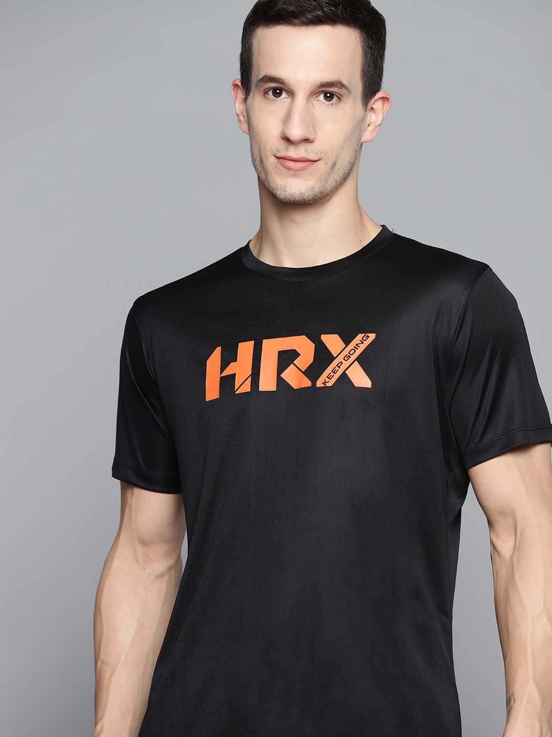 

HRX By Hrithik Roshan Training Men Jet Black & Orange Rapid-Dry Brand Carrier Tshirt