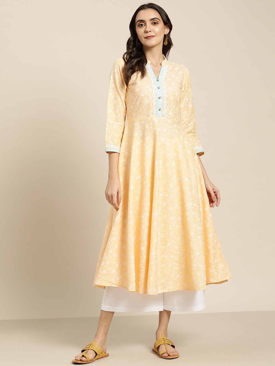 

Jompers Women Yellow & White Ethnic Motifs Printed Lace Detail Anarkali Kurta