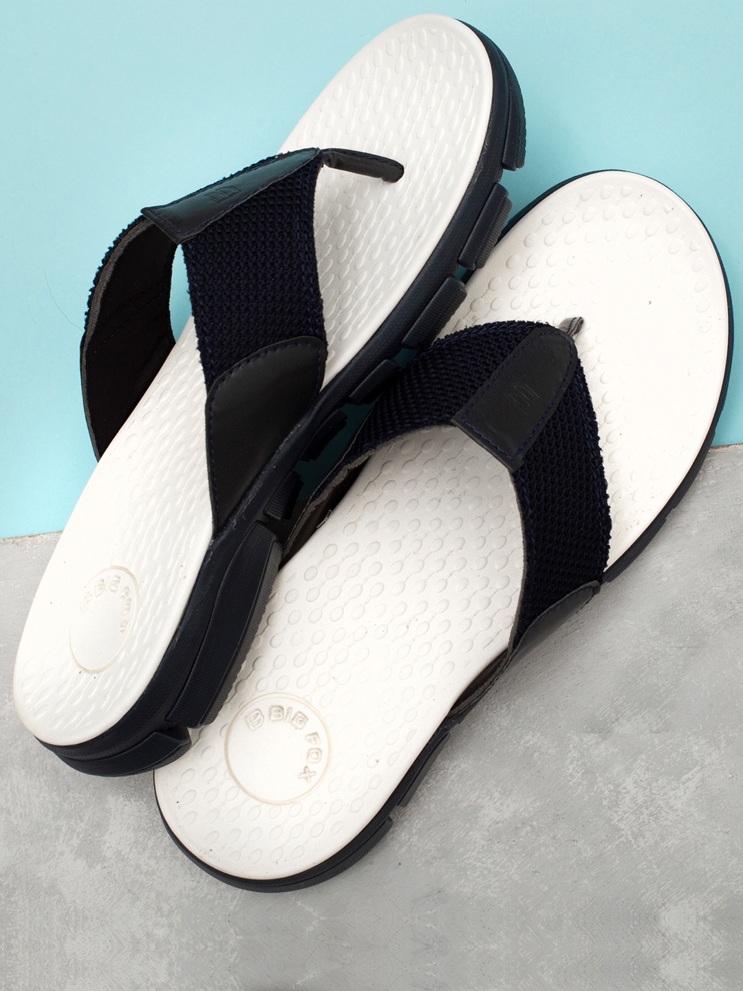 

Big Fox Men Blue & White Solid Thong Flip-Flops