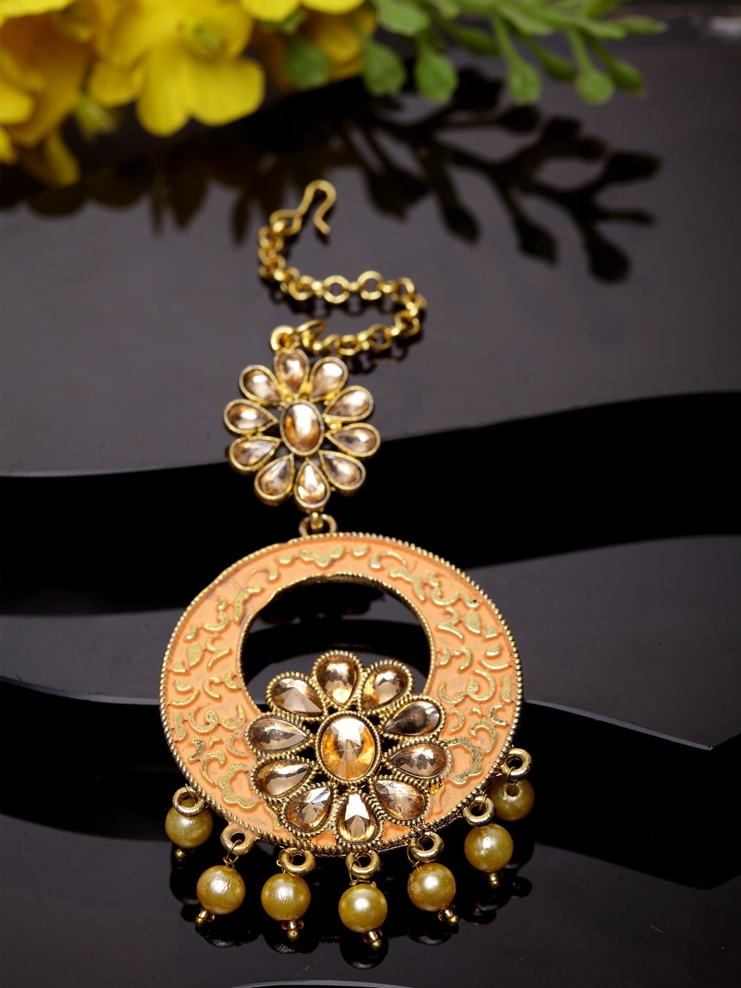 

ANIKAS CREATION Gold-Plated Peach-Coloured Stone-Studded & Beaded Enamelled Maang Tikka