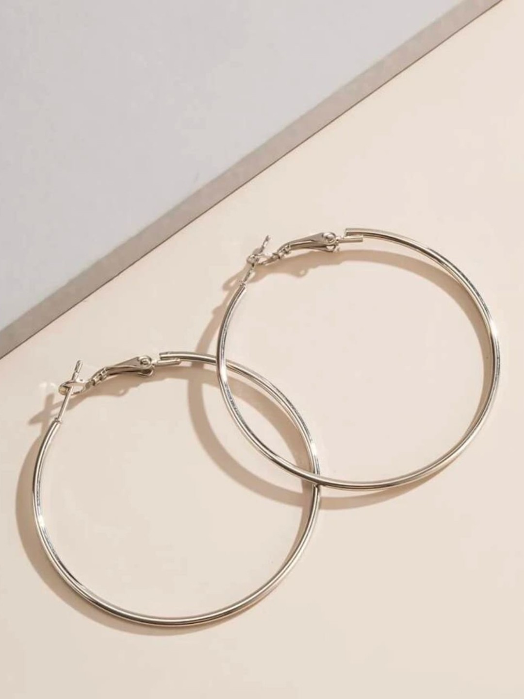 

ANNA CREATIONS Silver-Toned Contemporary Hoop Earrings