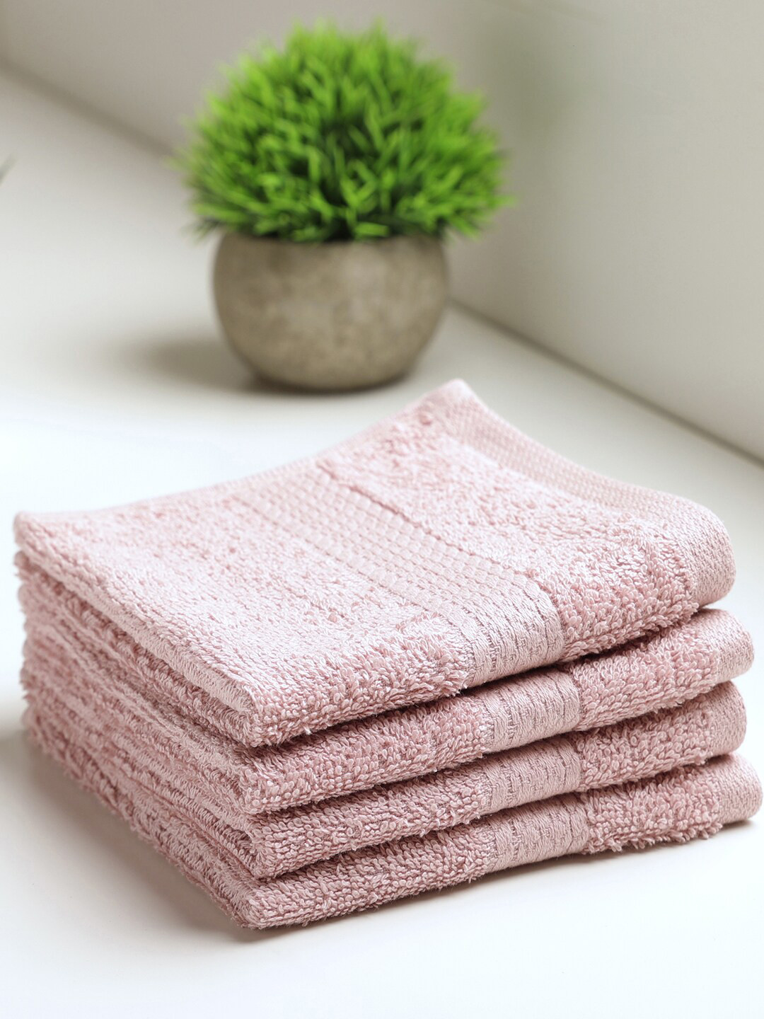 

SPACES Pack Of 4 Peach-Colored Solid 480 GSM Pure Cotton High Absorbent Face Towel