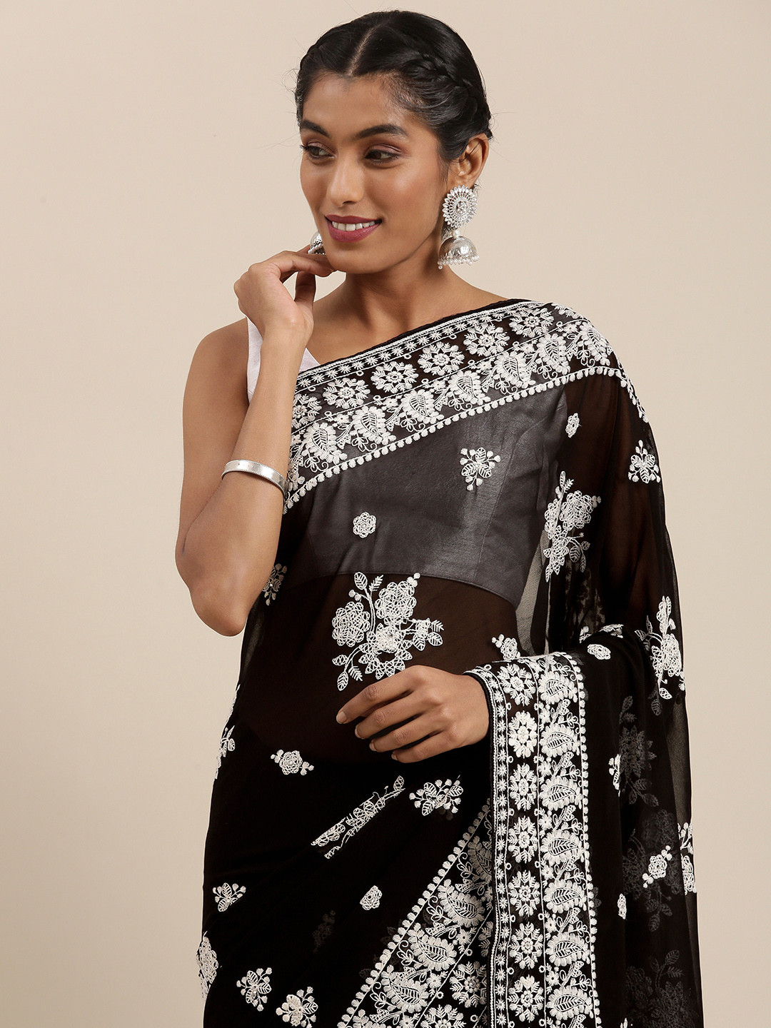 

Mitera Black & White Ethnic Motifs Embroidered Pure Georgette Saree