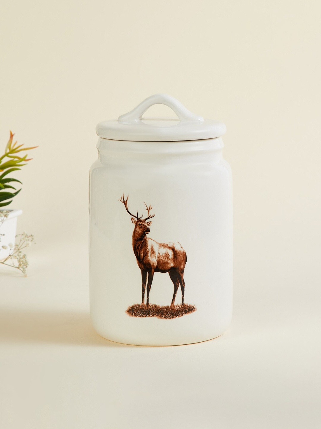 

Home Centre White Printed Reindeer Ceramic Canister