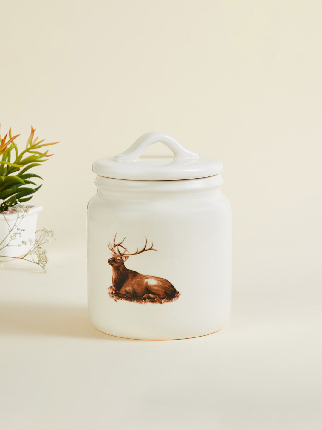 

Home Centre White Reindeer Printed Ceramic Decorative Canister