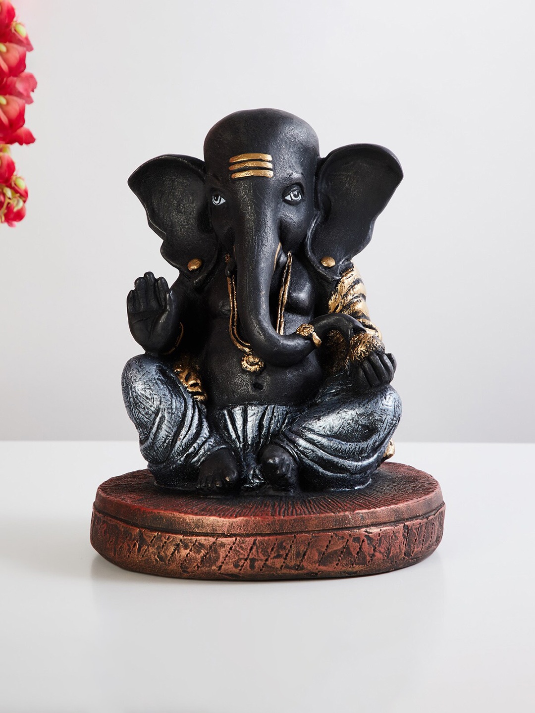 

Home Centre Black Ganpati Figurine Showpieces