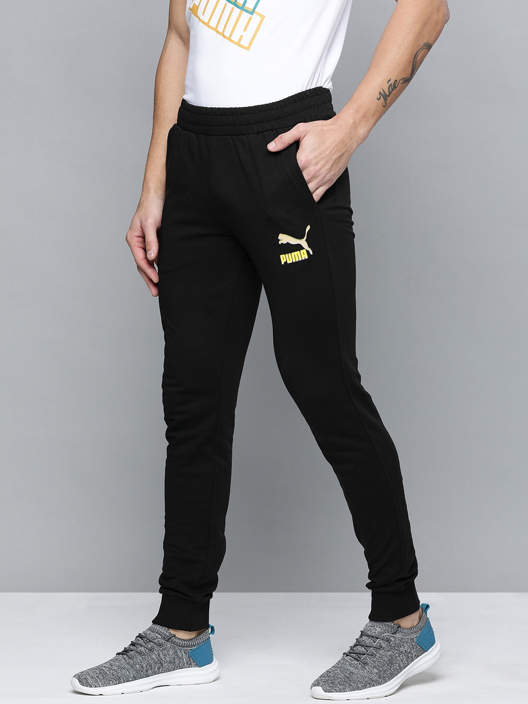

Puma Men Black Brand Logo Printed Mid-Rise Archive Graphic Regular Joggers