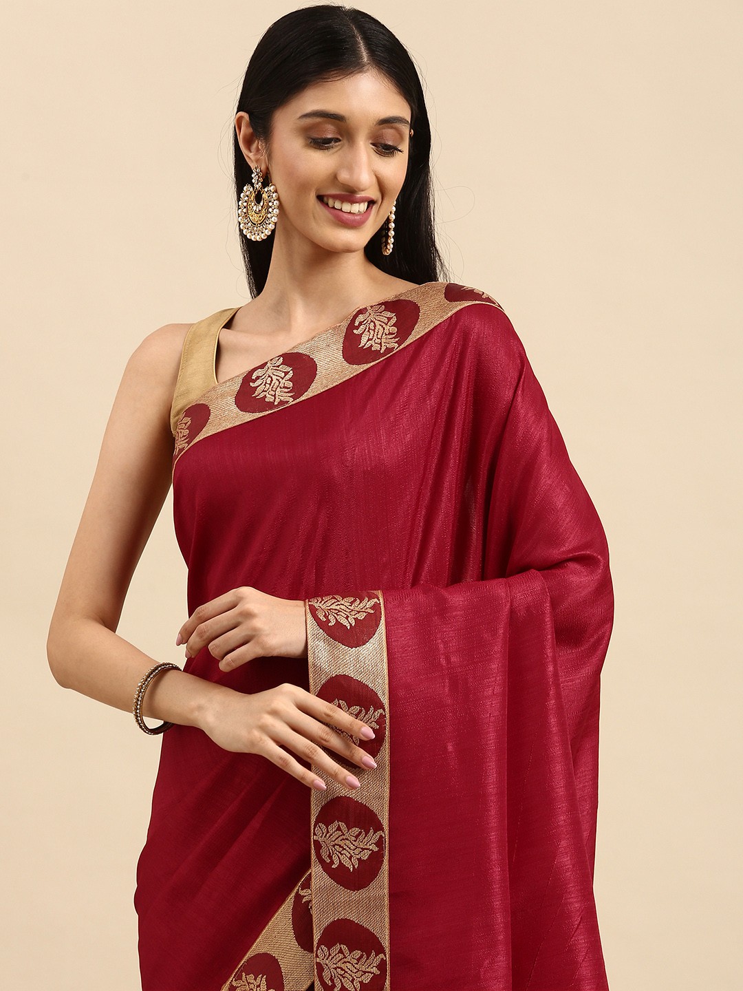 

Anouk Maroon & Golden Solid Saree with Woven Design Border