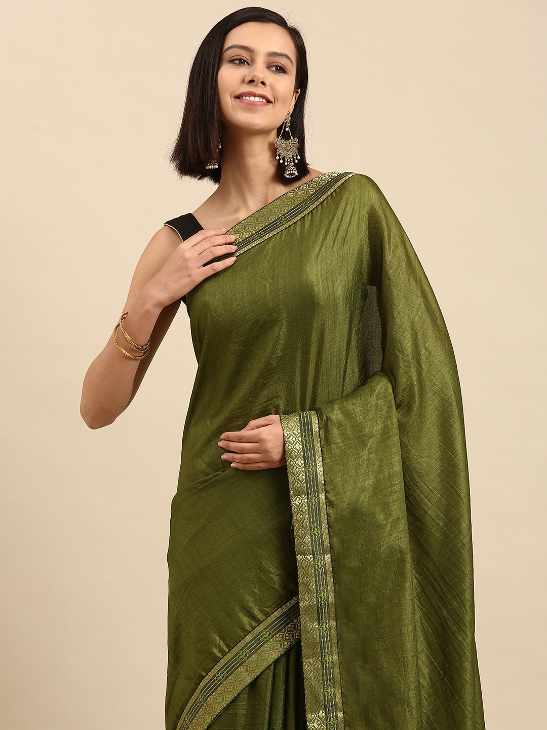 

Anouk Green Solid Saree with Woven Design Border