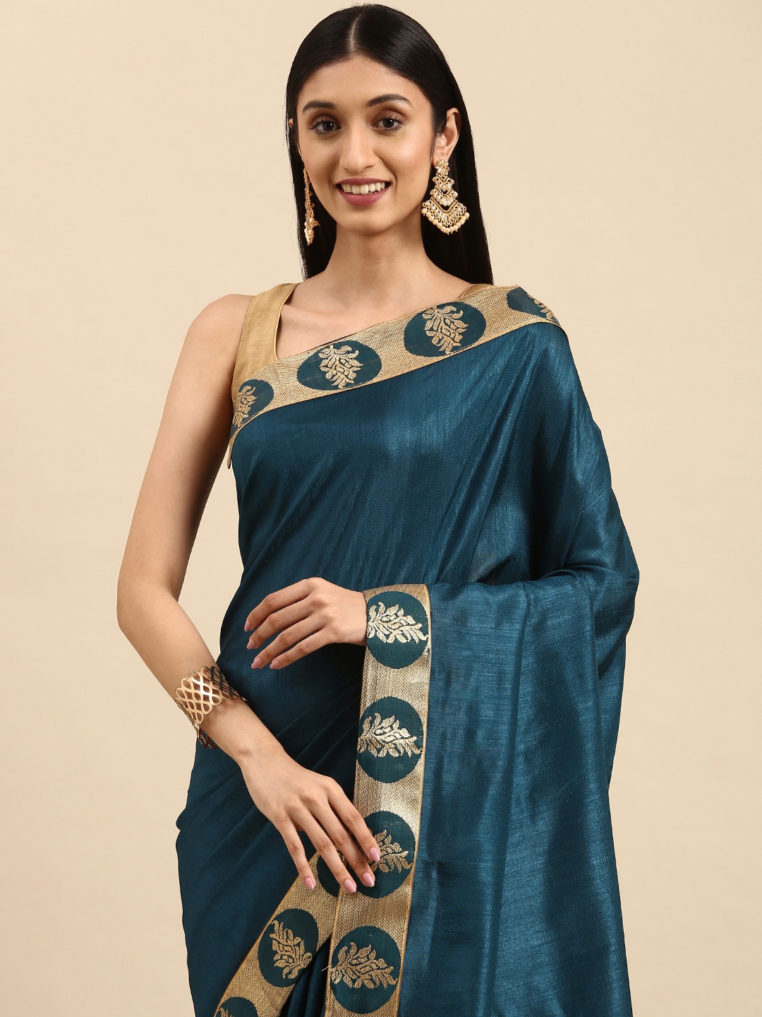 

Anouk Teal & Golden Saree with Woven Design Border