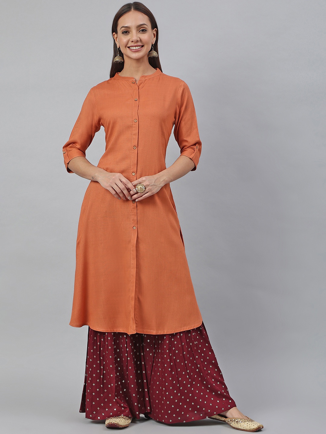 

Janasya Women Rust Rayon Slub Solid Shirt Style Kurta