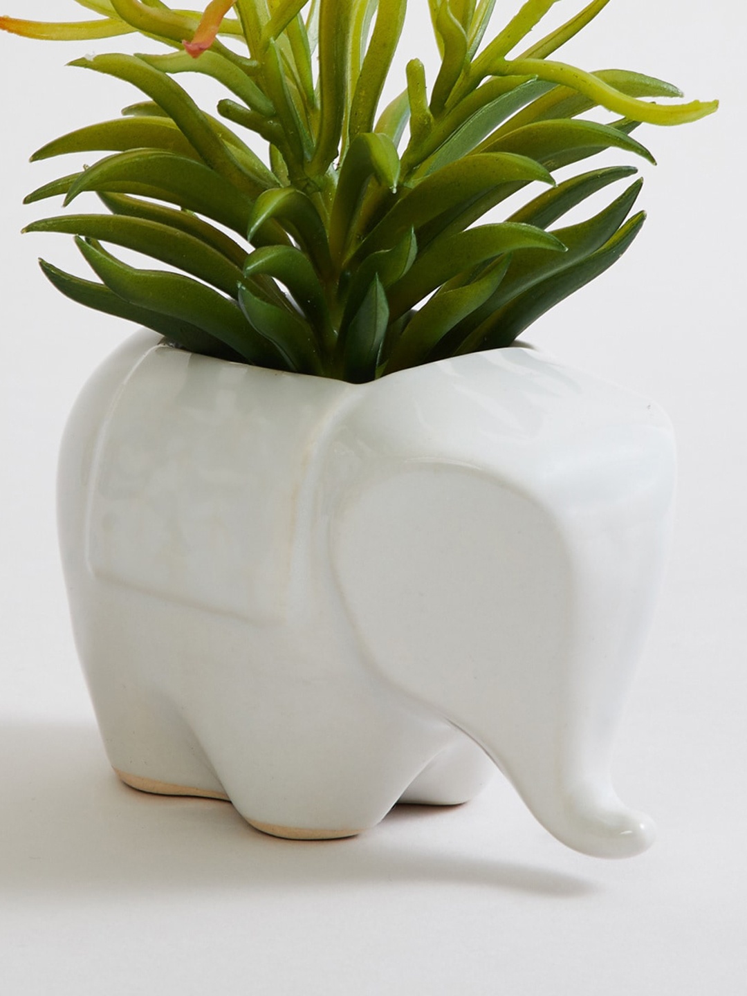 

Home Centre White Solid Elephant Ceramic Planter