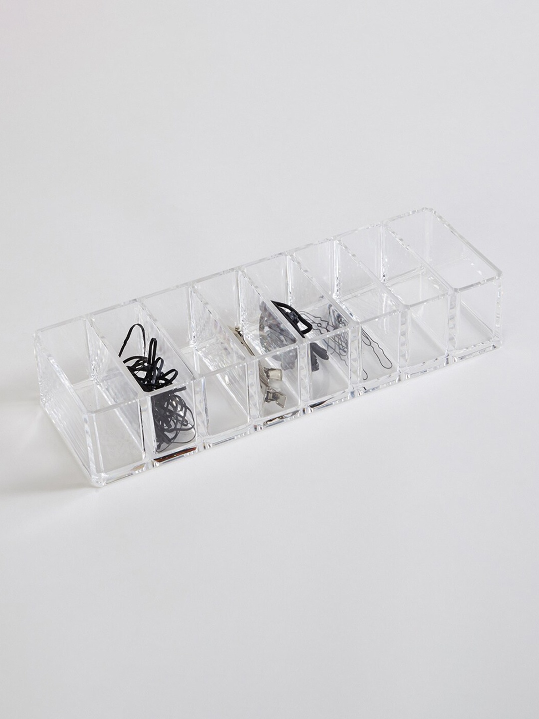 

Home Centre Orion Transparent Solid 8-Section Compact Holder