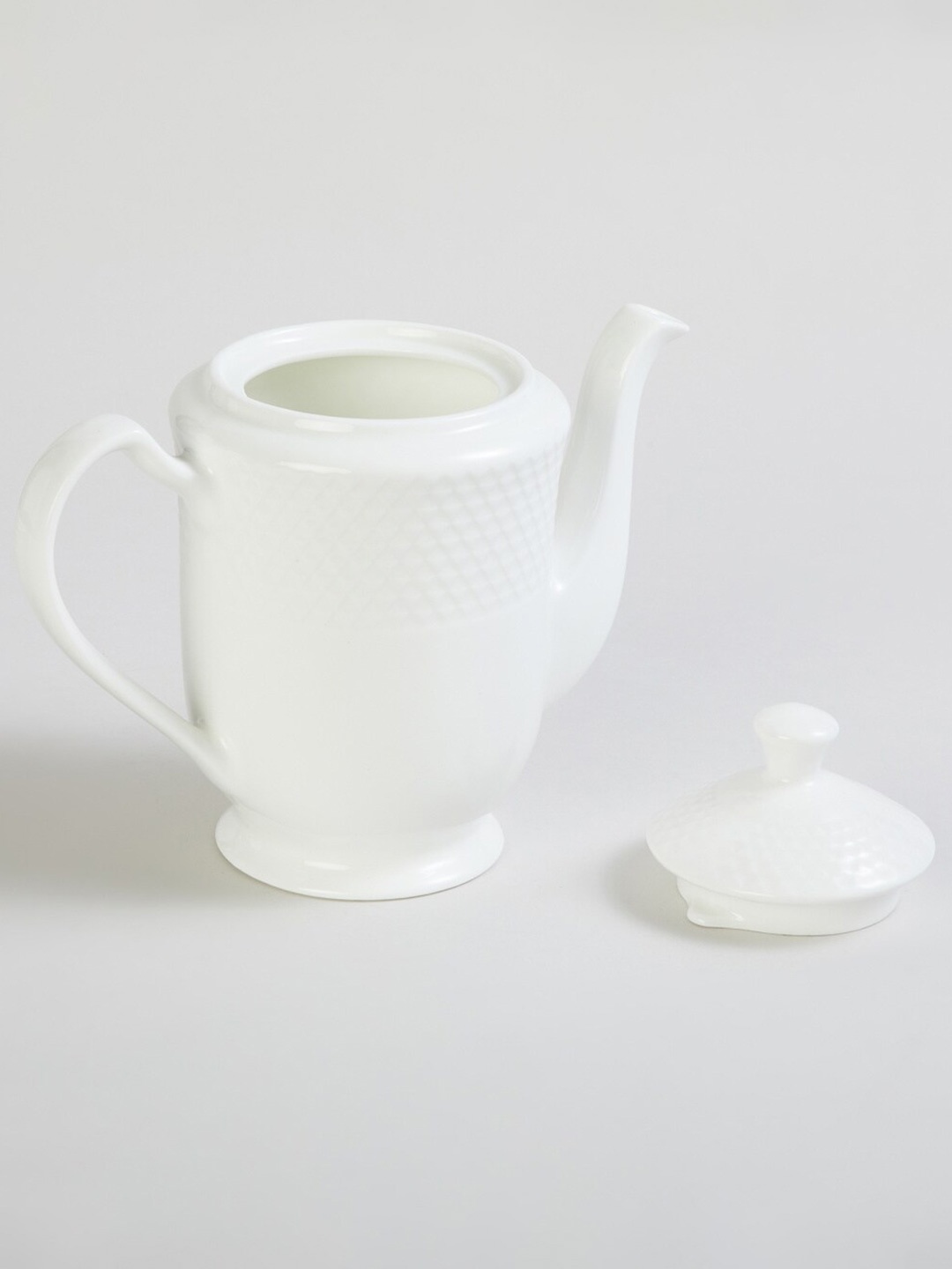 

Home Centre White Textured Bone China Tea Pot With Lid