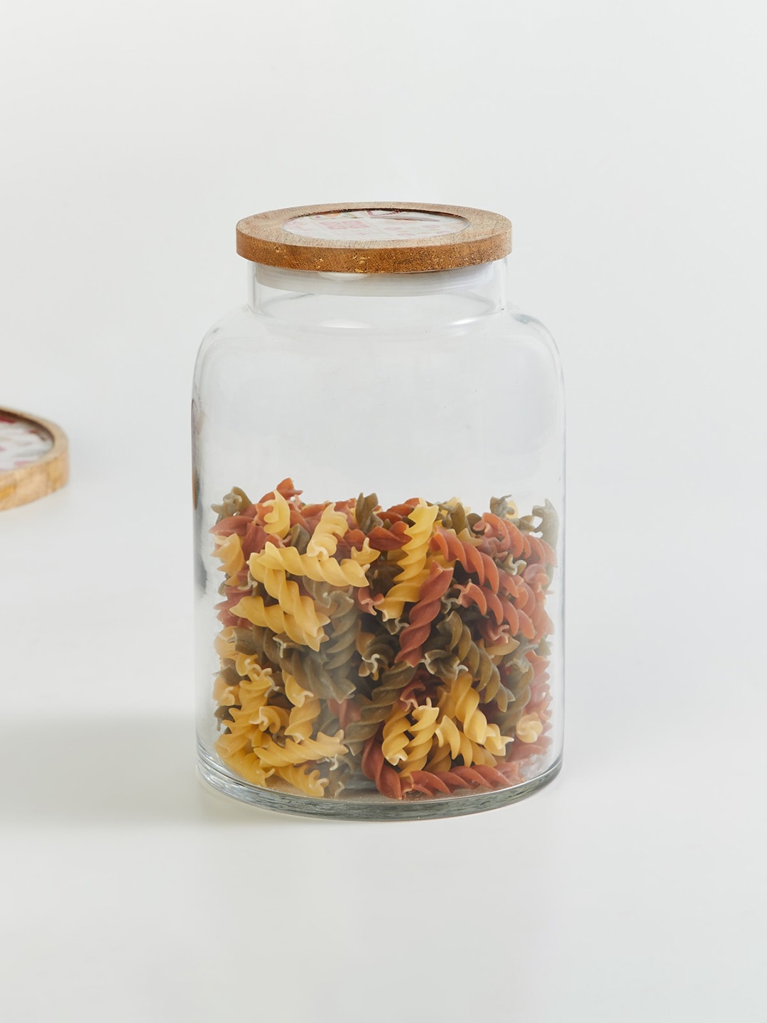 

Home Centre Transparent Glass Jar With Wooden Lid