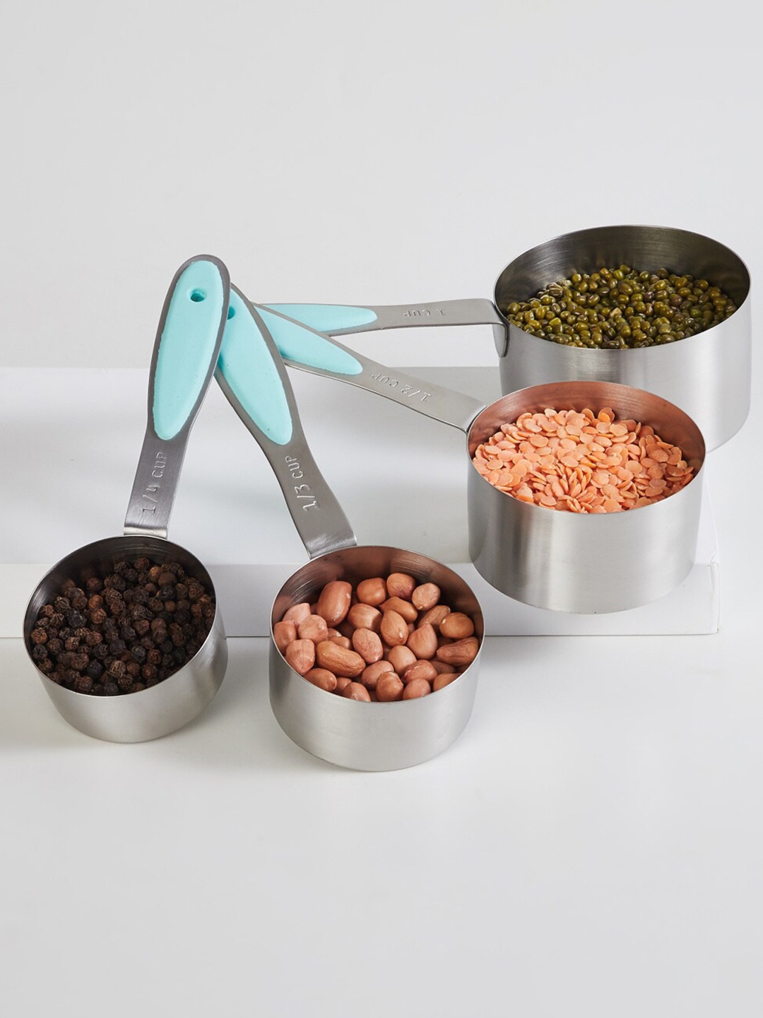 

Home Centre Set Of 4 Blue Solid Stainless Steel Measuring Spoons