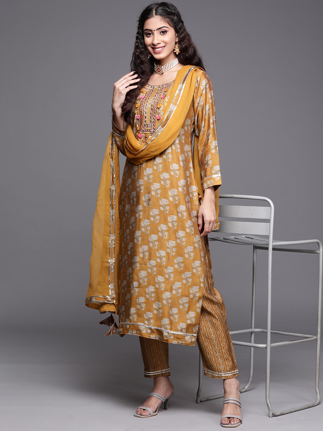 

KSUT Women Mustard Yellow Floral Embroidered Mirror Work Kurta with Palazzos & With Dupatta
