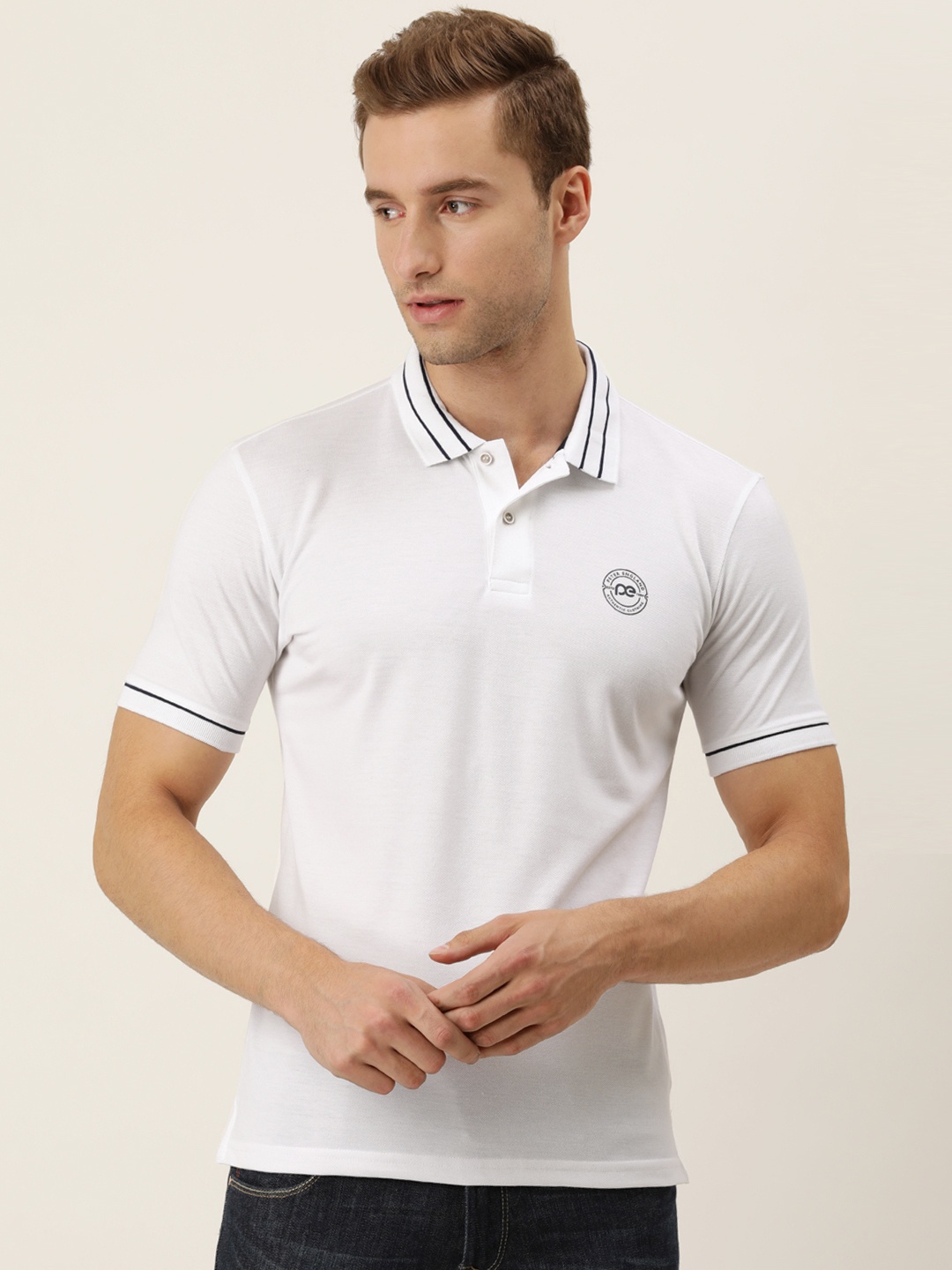 

Peter England Men White Solid Polo Collar T-shirt