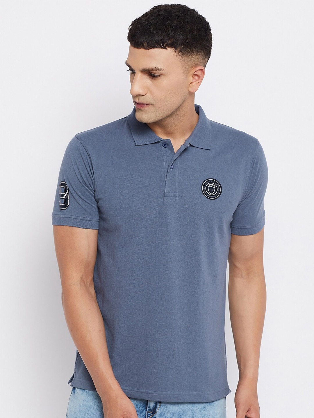 

Okane Men Blue Solid Polo Collar T-shirt