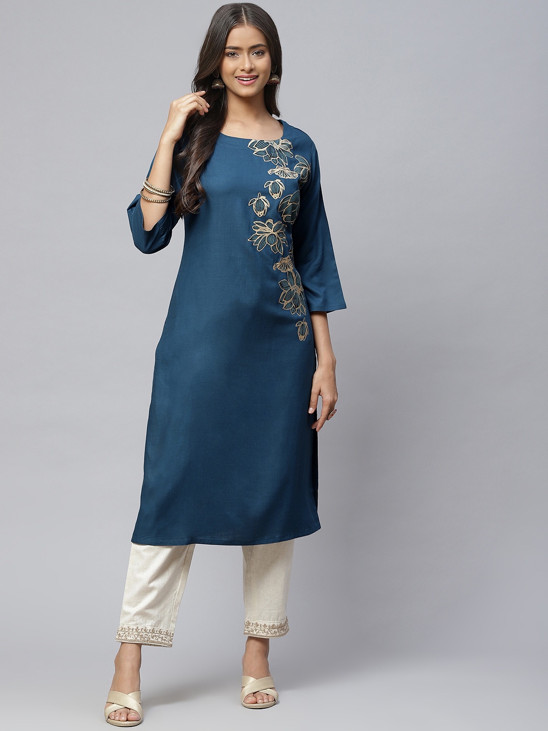 

Aarika Women Teal Blue & Golden Floral Printed Pure Cotton Kurta