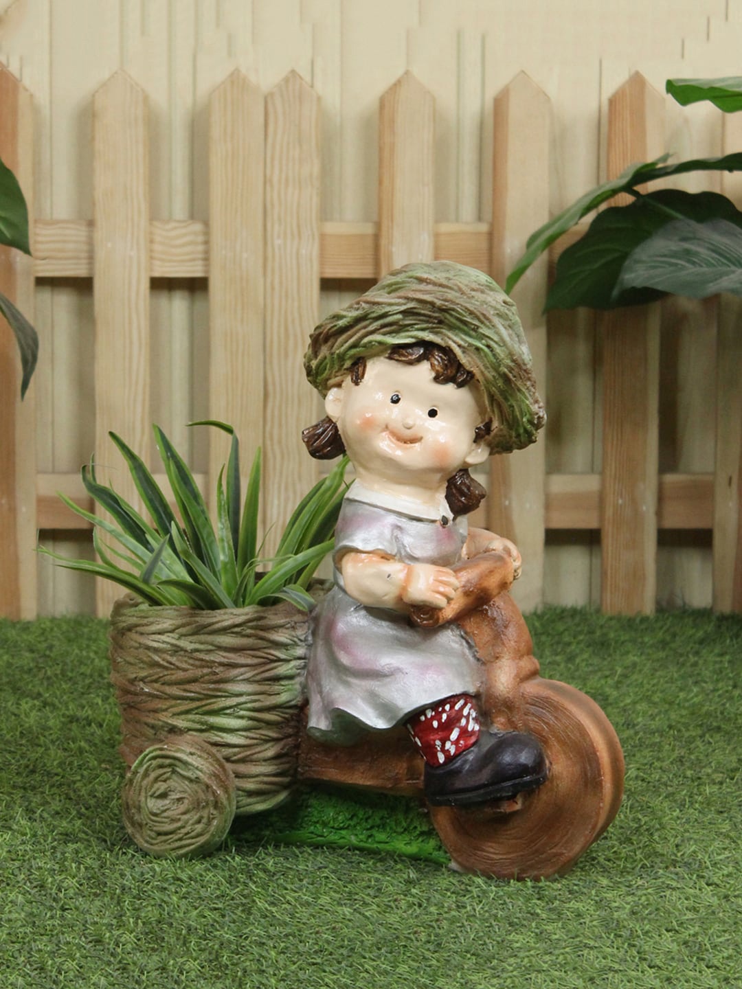 

Wonderland Brown Attractive Girl On Bike Planter