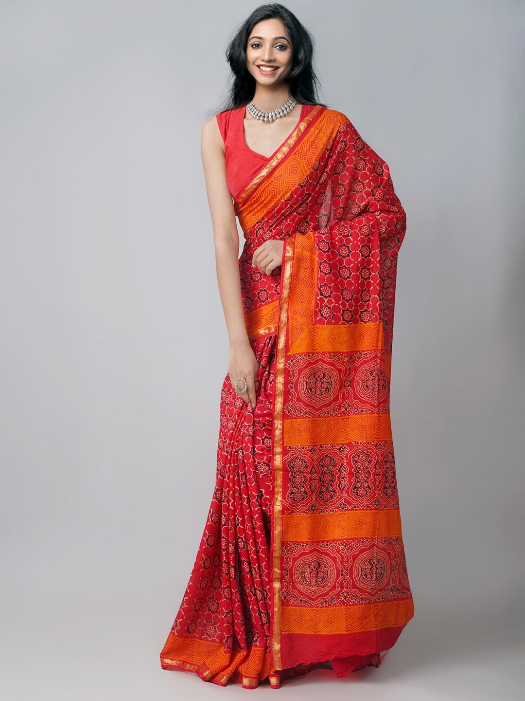 

Unnati Silks Red & Orange Ethnic Motifs Zari Patola Saree