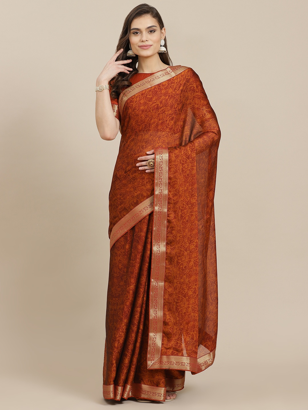 

Mitera Rust Orange Ethnic Motifs Poly Chiffon Saree