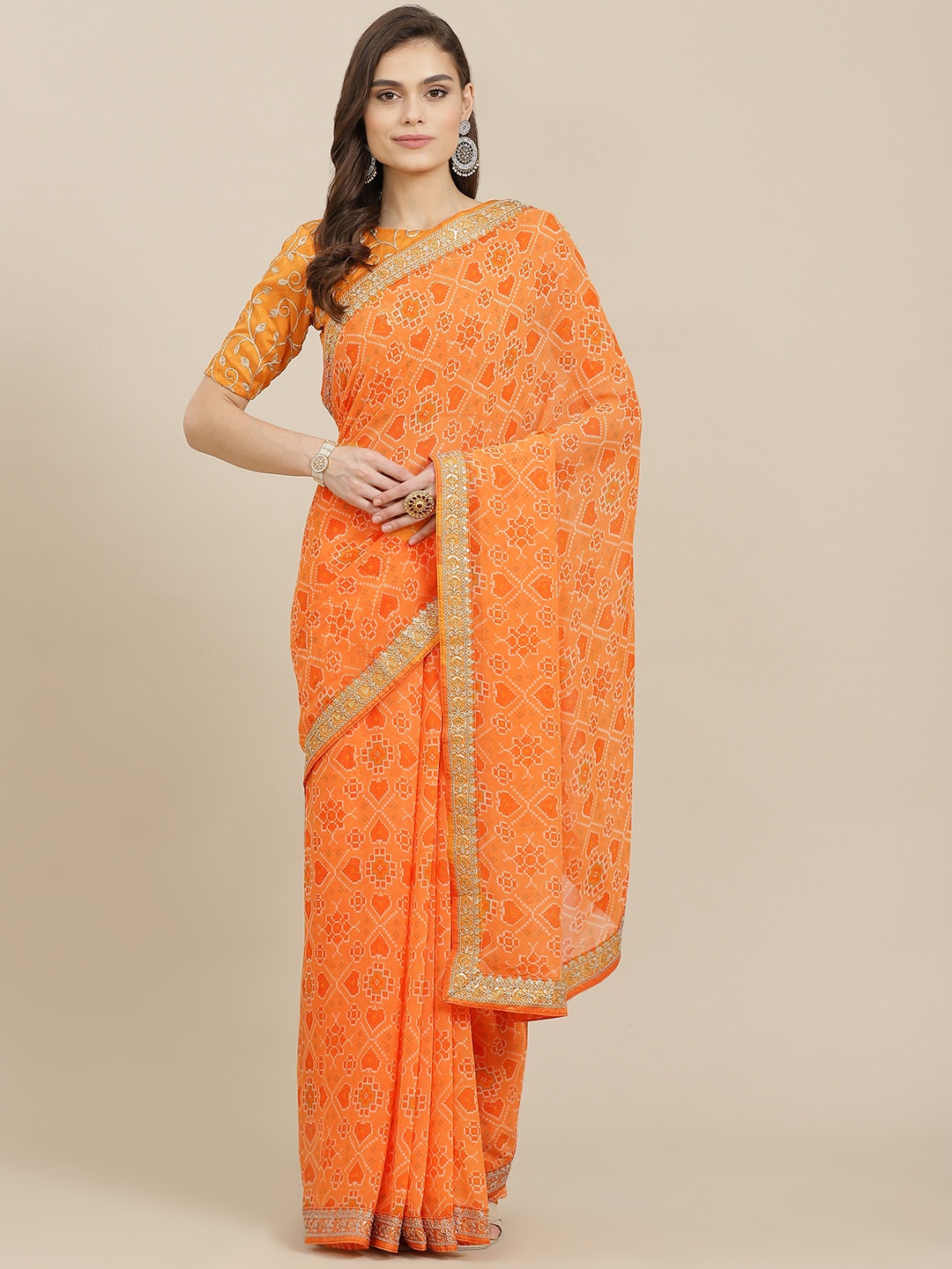 

Mitera Orange Ethnic Motifs Sequinned Poly Georgette Saree