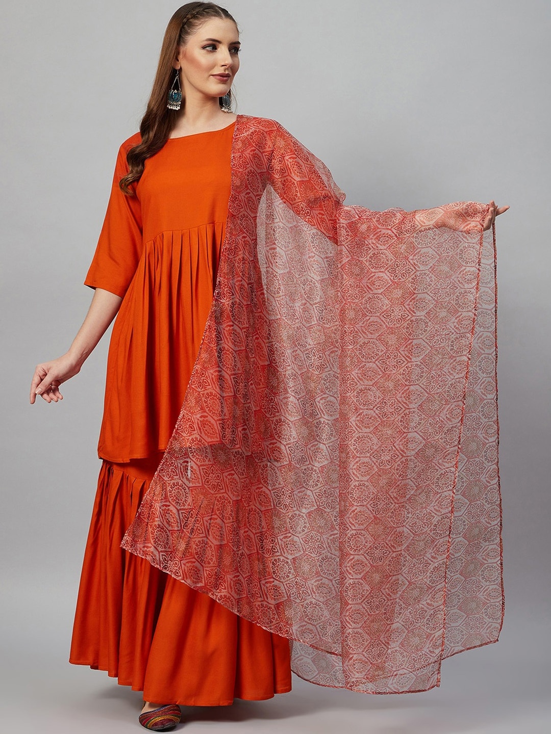 

InWeave Women Orange Pleated Kurta with Sharara & With Dupatta