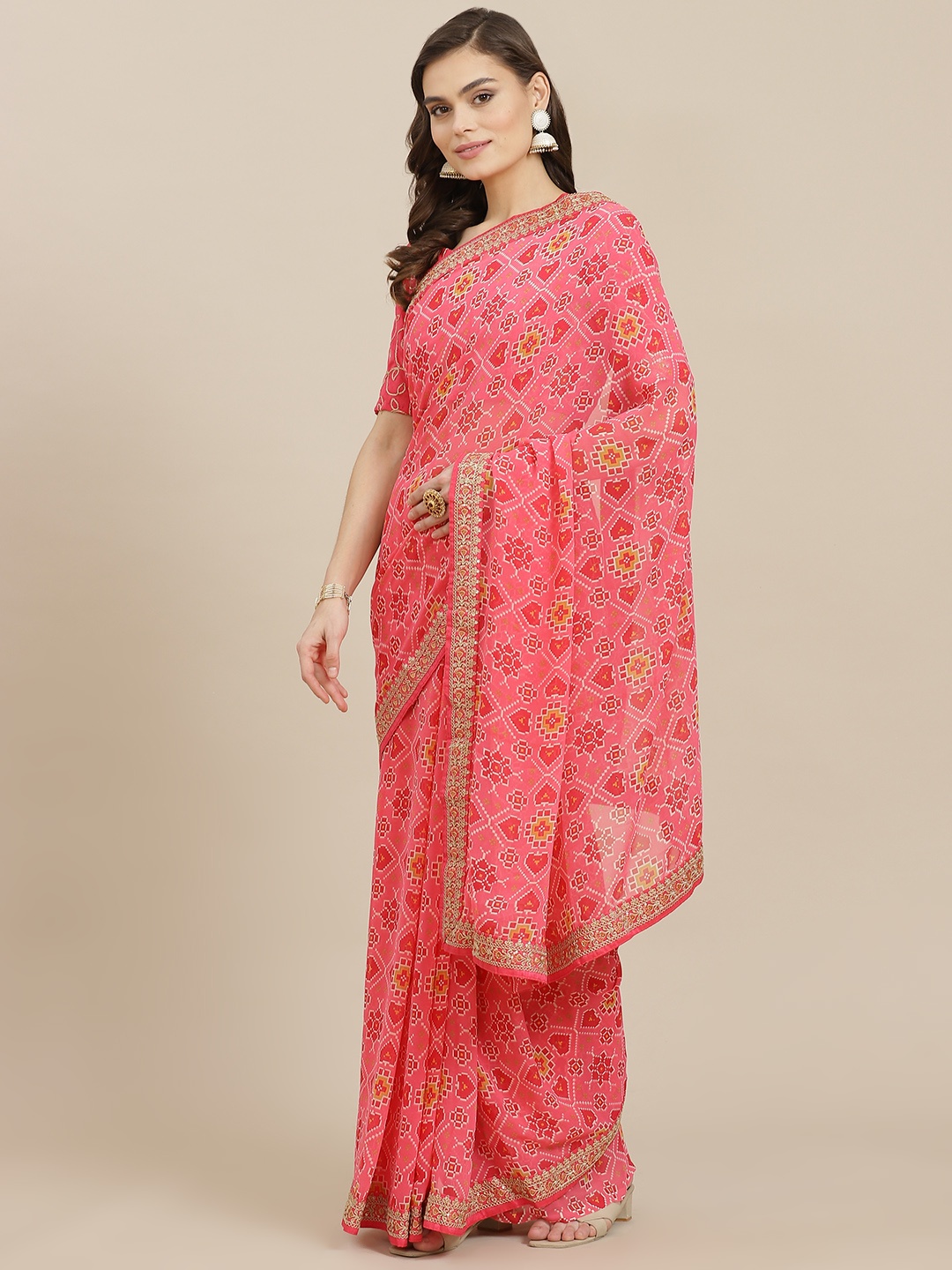 

Mitera Coral Pink Ethnic Motifs Sequinned Poly Georgette Saree