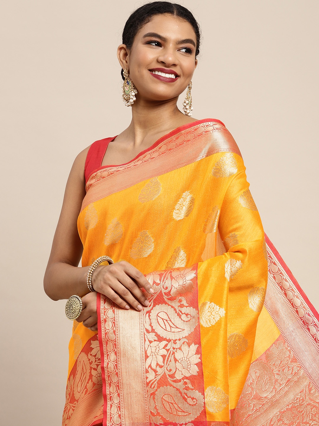 

Silk Land Yellow & Golden Ethnic Motifs Zari Banarasi Saree