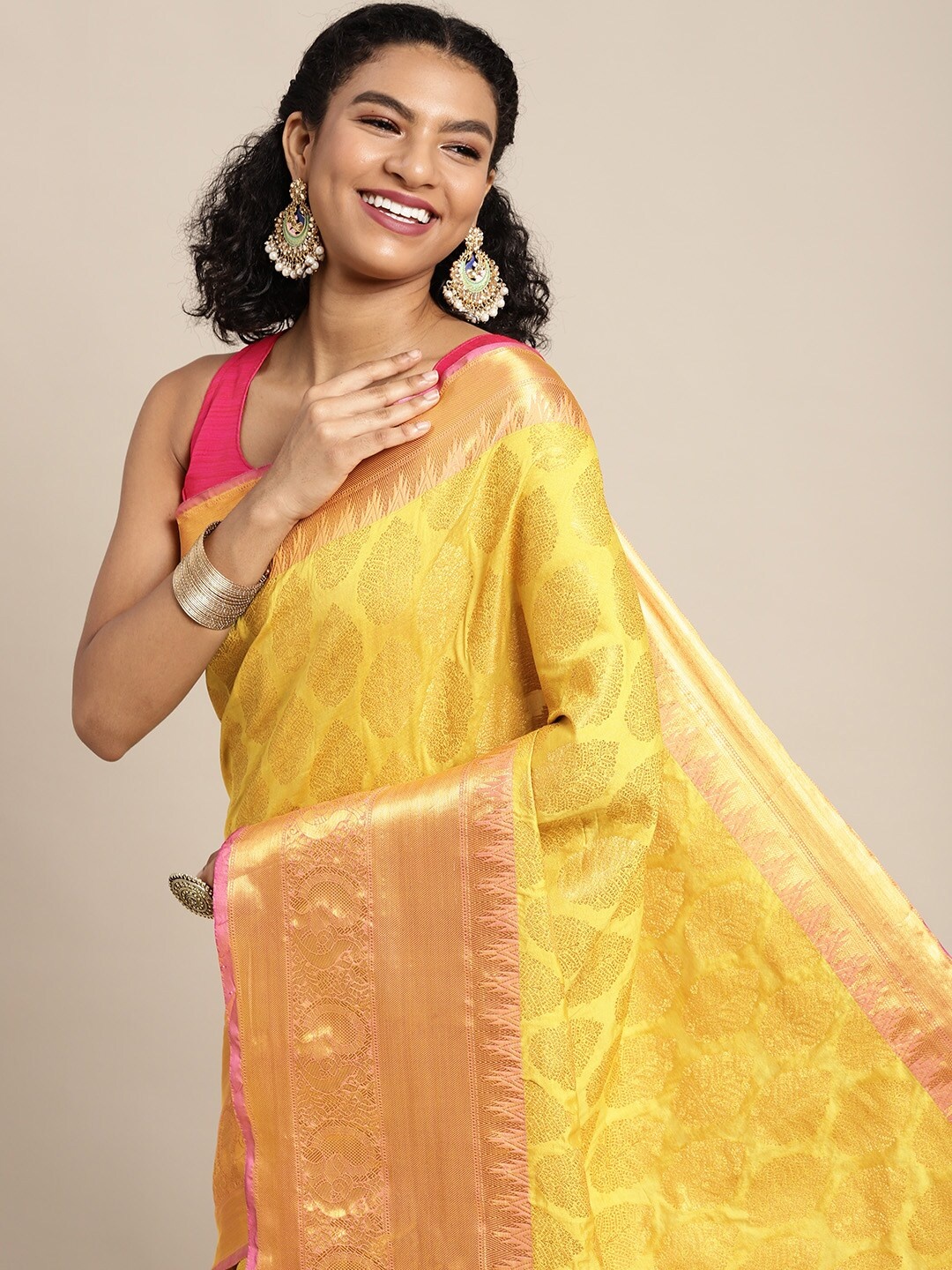 

Silk Land Yellow & Golden Ethnic Motifs Zari Banarasi Saree