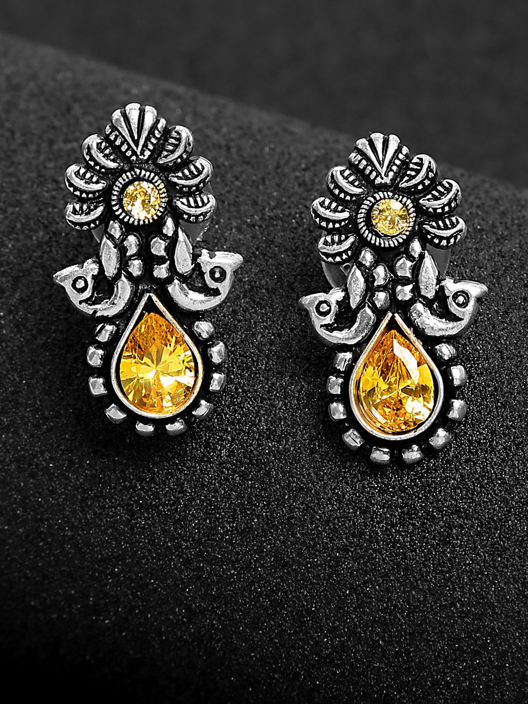 

Yellow Chimes Silver-Toned & Yellow Kolhapuri Oxidised Studs Earrings