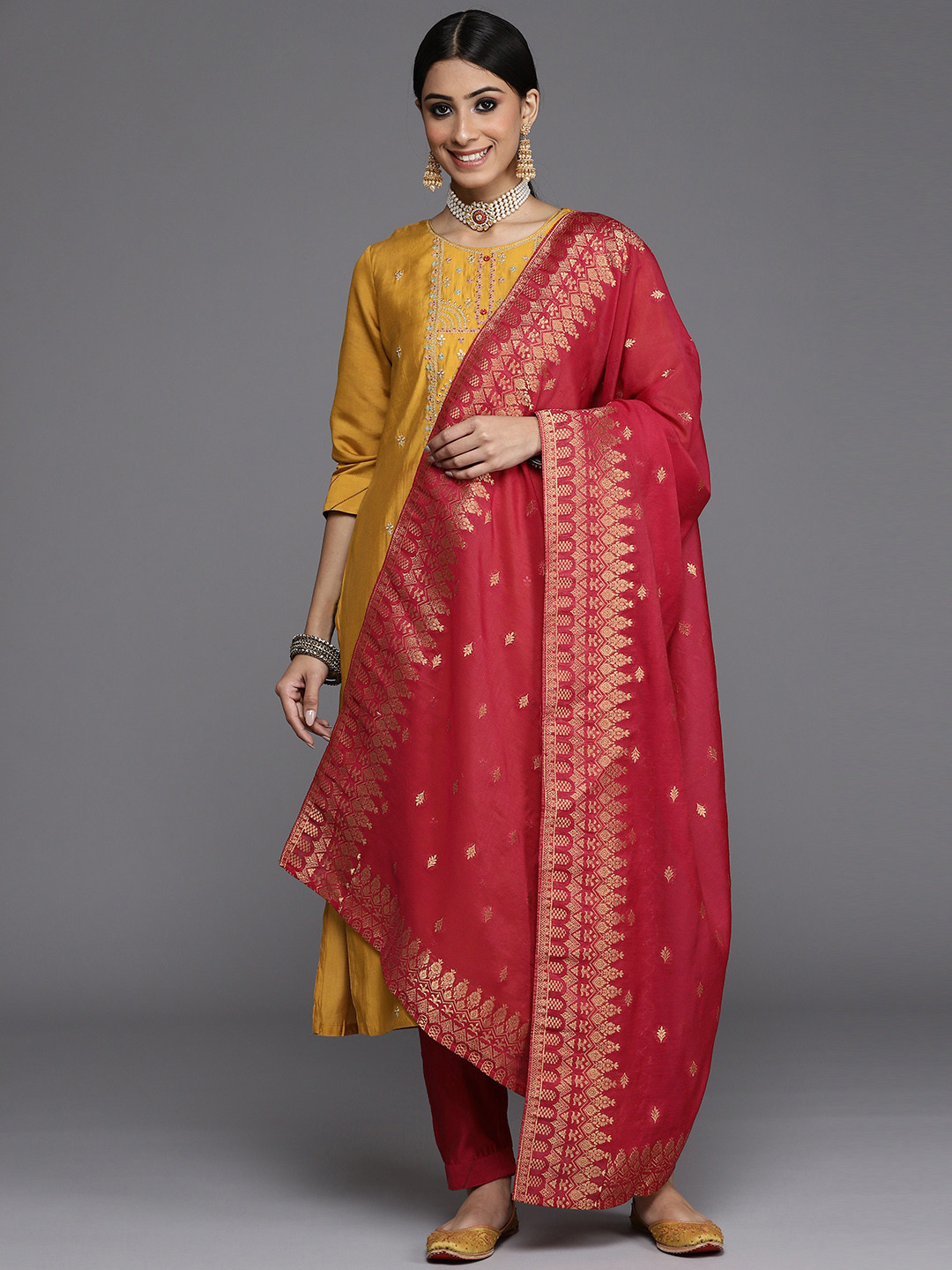 

Varanga Women Mustard Yellow Ethnic Motifs Embroidered Kurta with Trousers & Dupatta