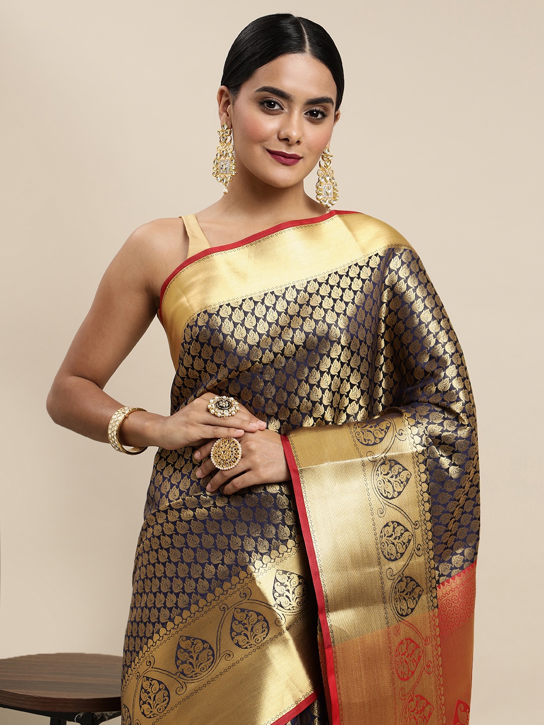 

Mitera Navy Blue & Golden Ethnic Motifs Zari Silk Blend Kanjeevaram Saree