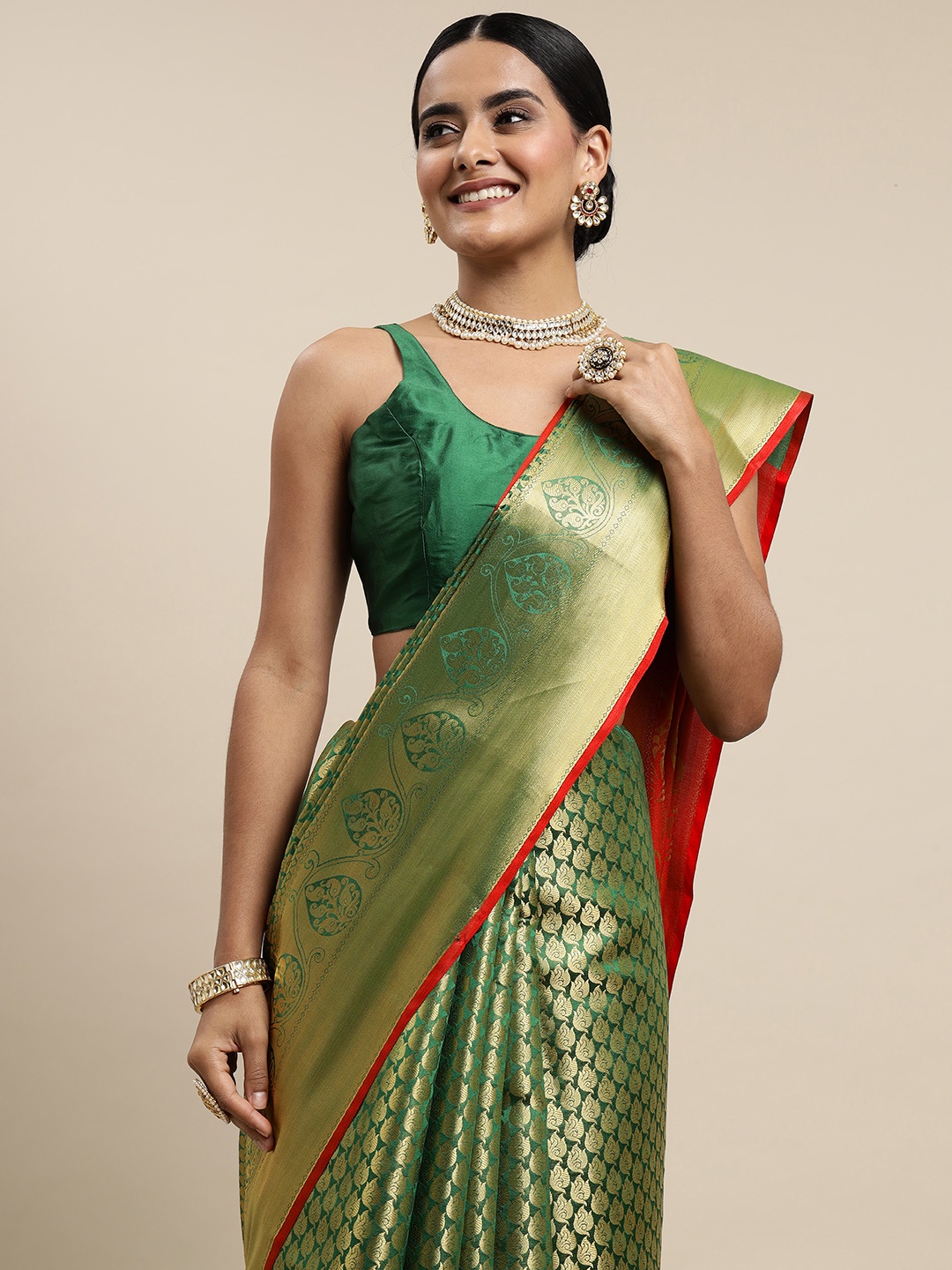 

Mitera Green & Golden Ethnic Motifs Zari Silk Blend Saree