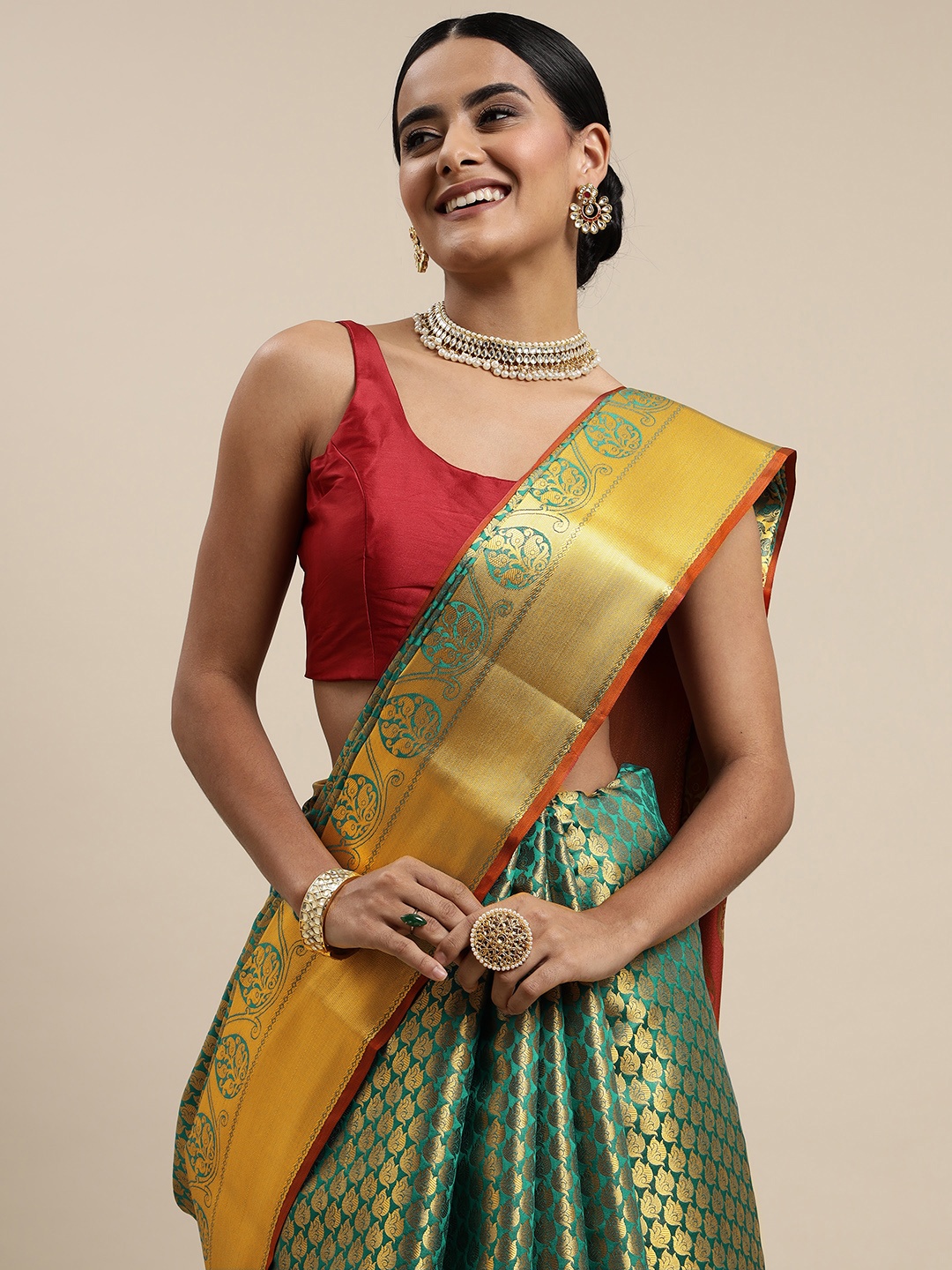 

Mitera Green & Red Ethnic Motifs Zari Silk Blend Saree