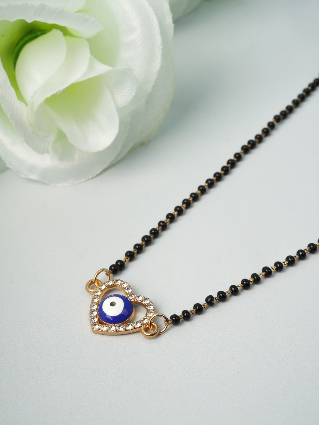 

Ferosh Gold-Toned & Black Stone Studded & Beaded Heart Evil Eye Mangalsutra