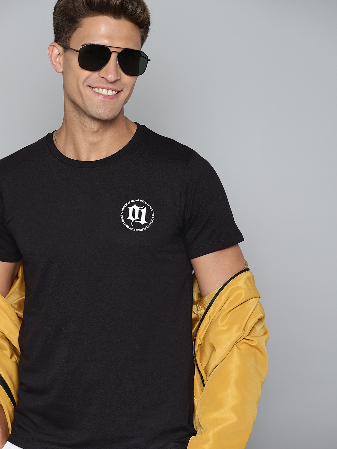 

HERE&NOW Men Black Solid T-shirt