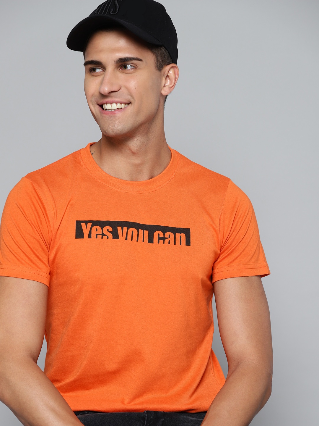 

HERE&NOW Men Orange 7 Black Typography Printed T-shirt