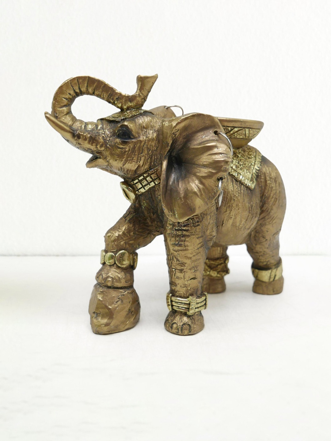 

Home Centre Gold-Tone Elephant Figurine T-Light Holder